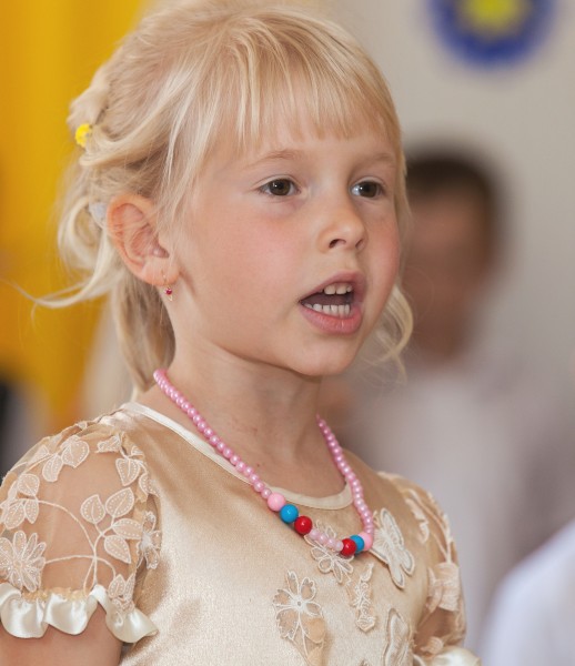a young blond schoolgirl photographed in May 2014, picture 1/2