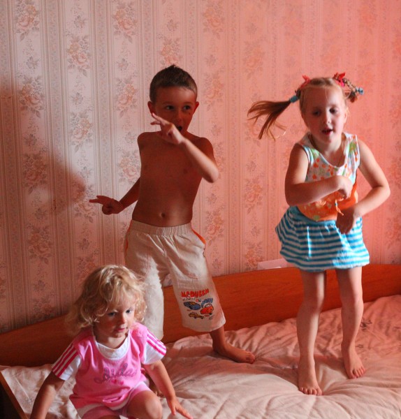 Children dancing on a bed, picture 2