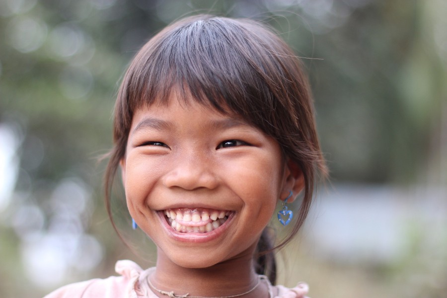 Lao little girl laughing with teeth