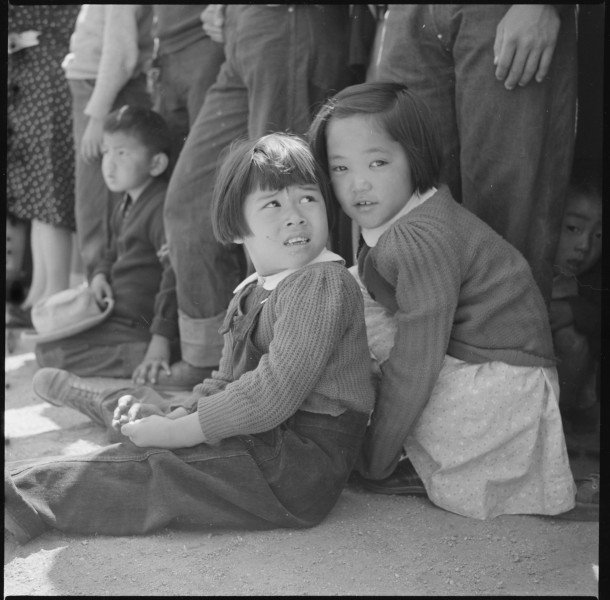 Manzanar Relocation Center, Manzanar, California. Little evacuees of Japanese descent watch Memoria . . . - NARA - 538542