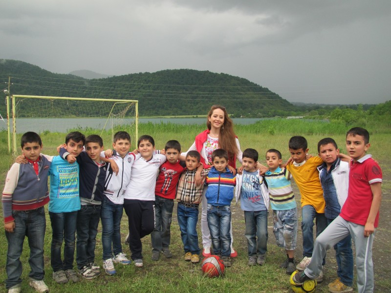 Picnic in Qabala. School children on the football ground