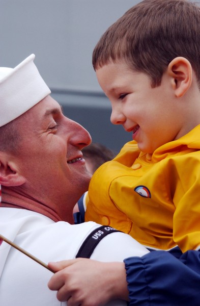 US Navy 020425-N-1110A-502 Sailor is greeted by son during homecoming