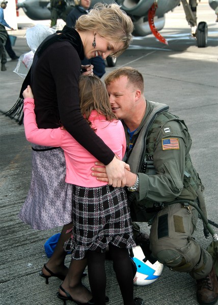 US Navy 050301-N-3770P-001 An air crew member greets his loved ones after returning from a deployment to the Western Pacific Ocean aboard USS Abraham Lincoln (CVN 72)