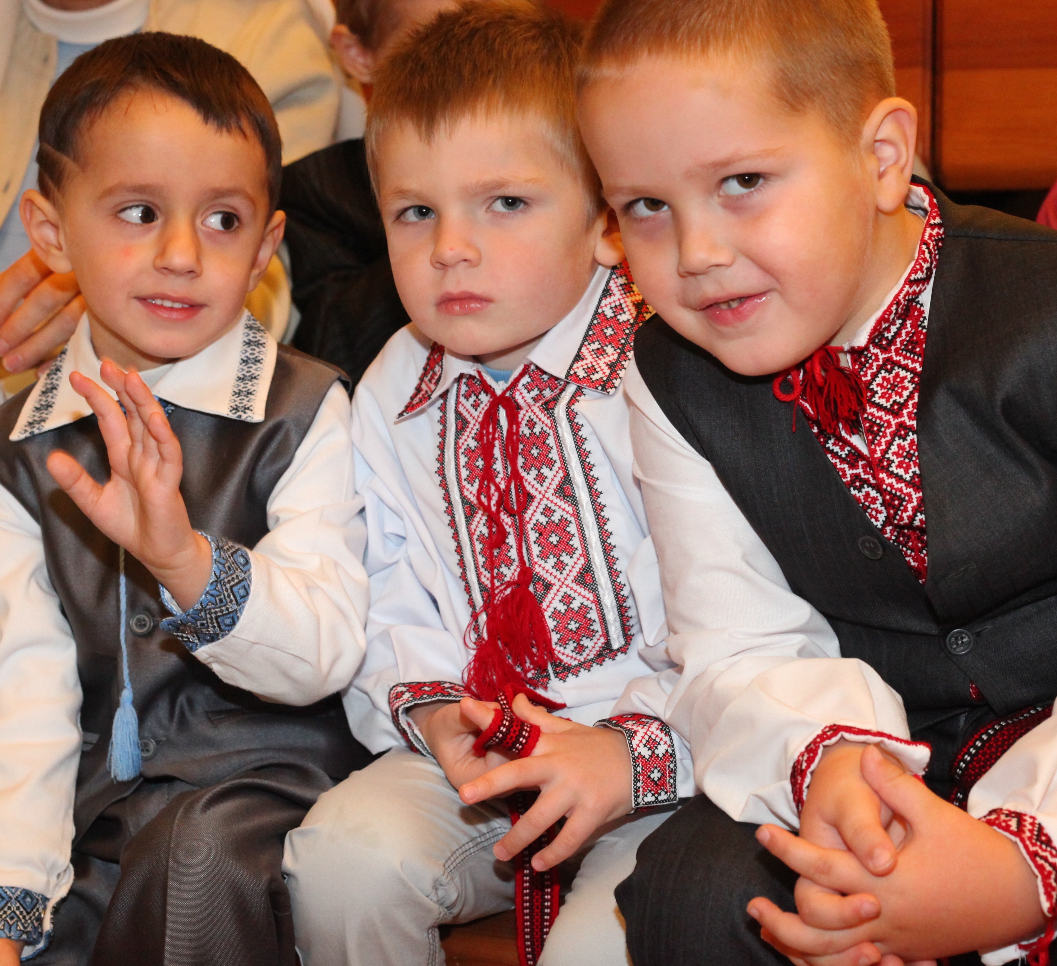 three child boys in a Church in a Catholic kindergarten
