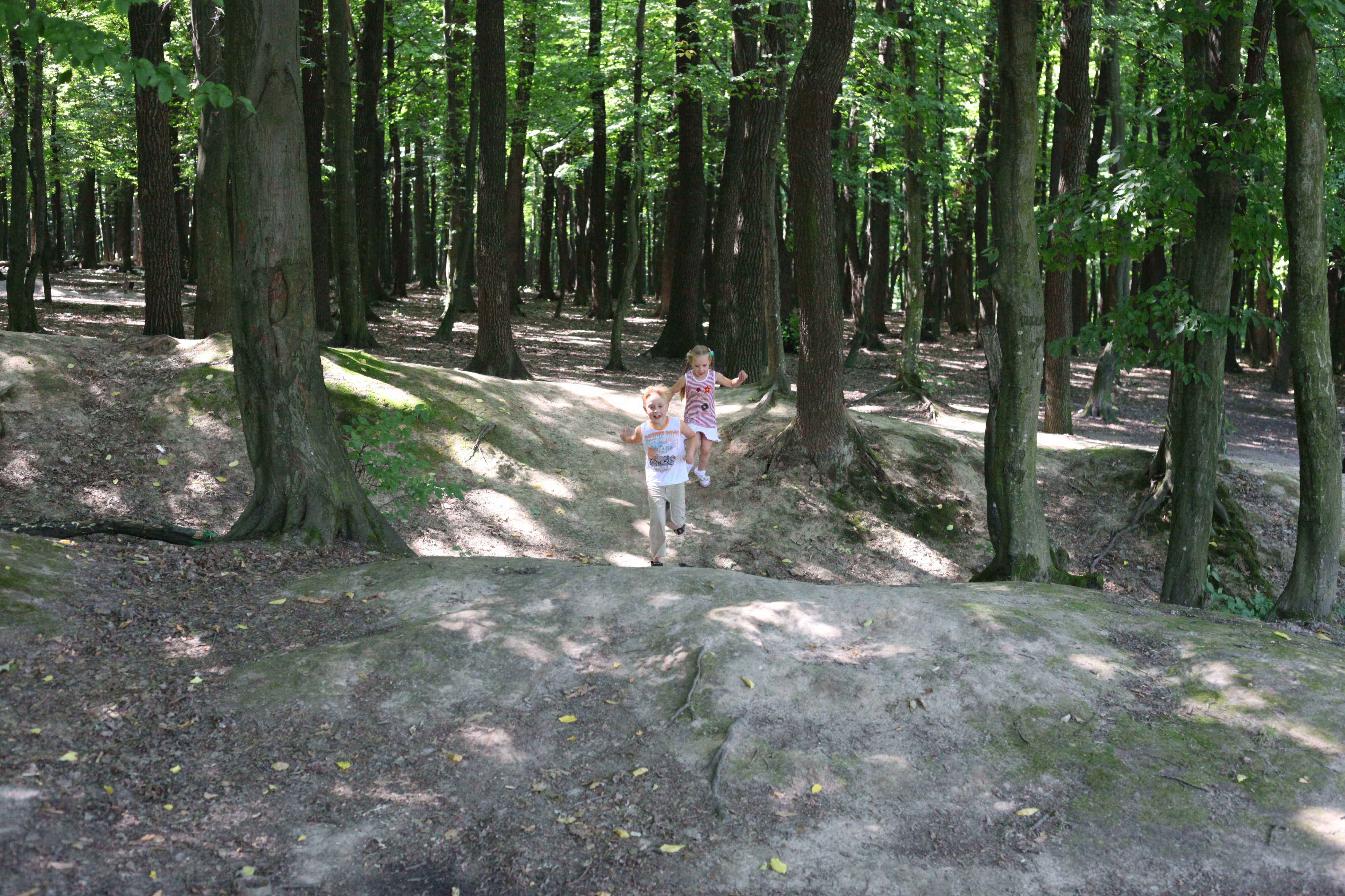 Kids running in a forest