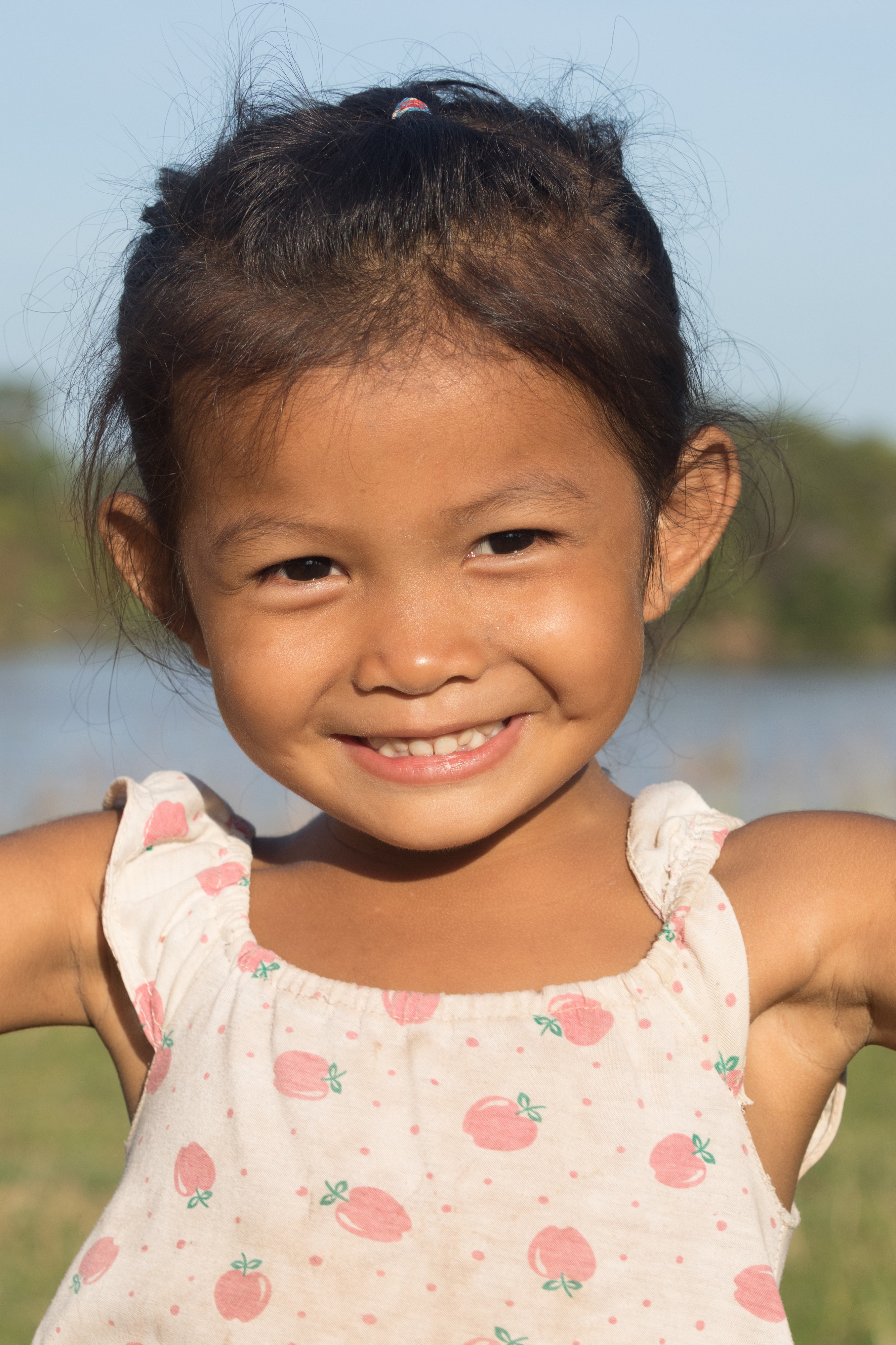 Young girl smiling in sunshine