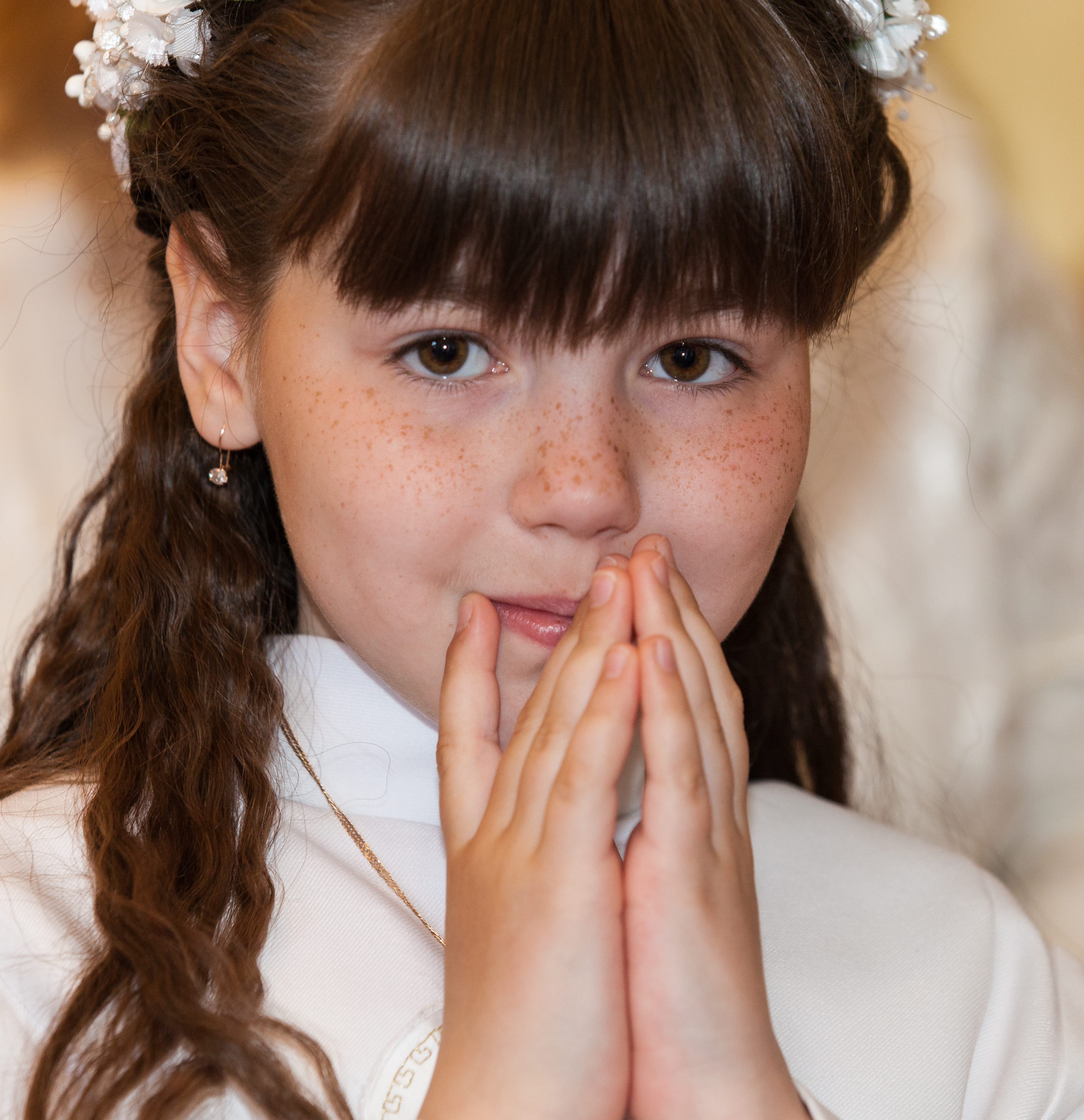 a Catholic child girl on her first Holy Communion Mass in June 2014, picture 1/4