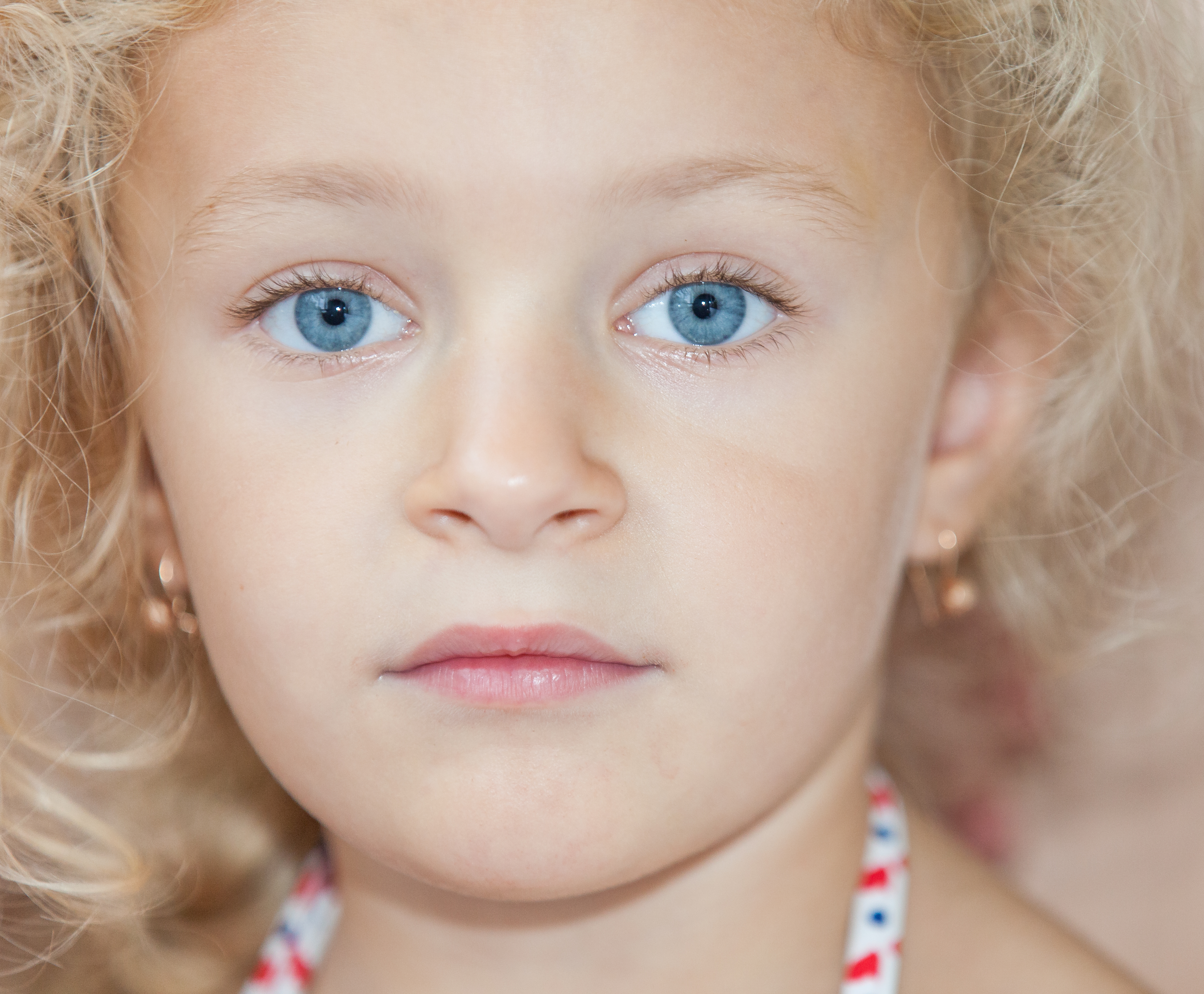 a cute blond child girl photographed in August 2014, picture 3
