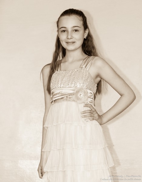 a beautiful schoolgirl wearing a dress photographed in June 2015, picture 15