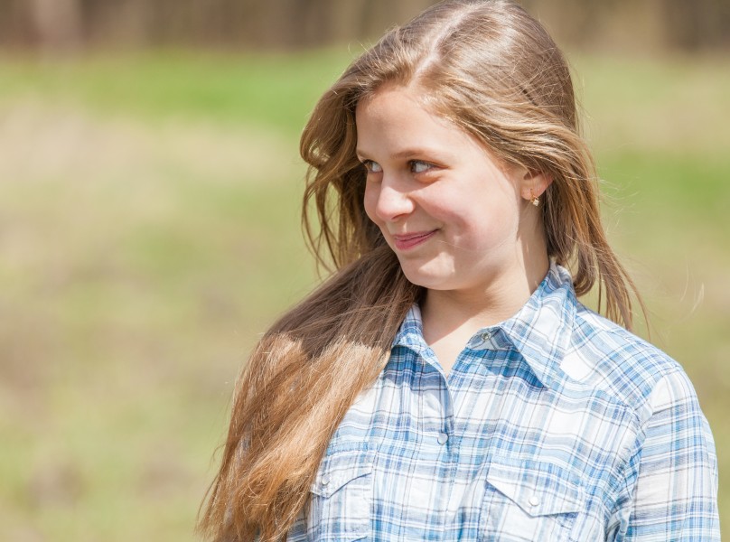 a cute blond 12-year-old girl photographed in April 2015, picture 5