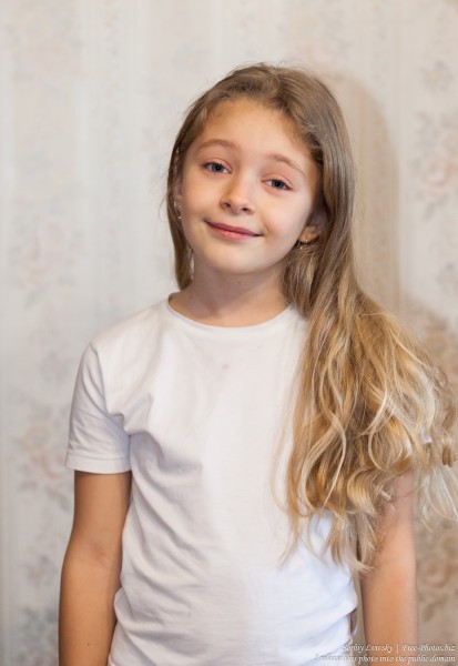 a cute blond child girl photographed in January 2017, picture 1