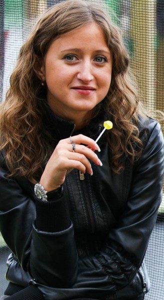 a pretty Catholic girl with a lollipop photographed in September 2013