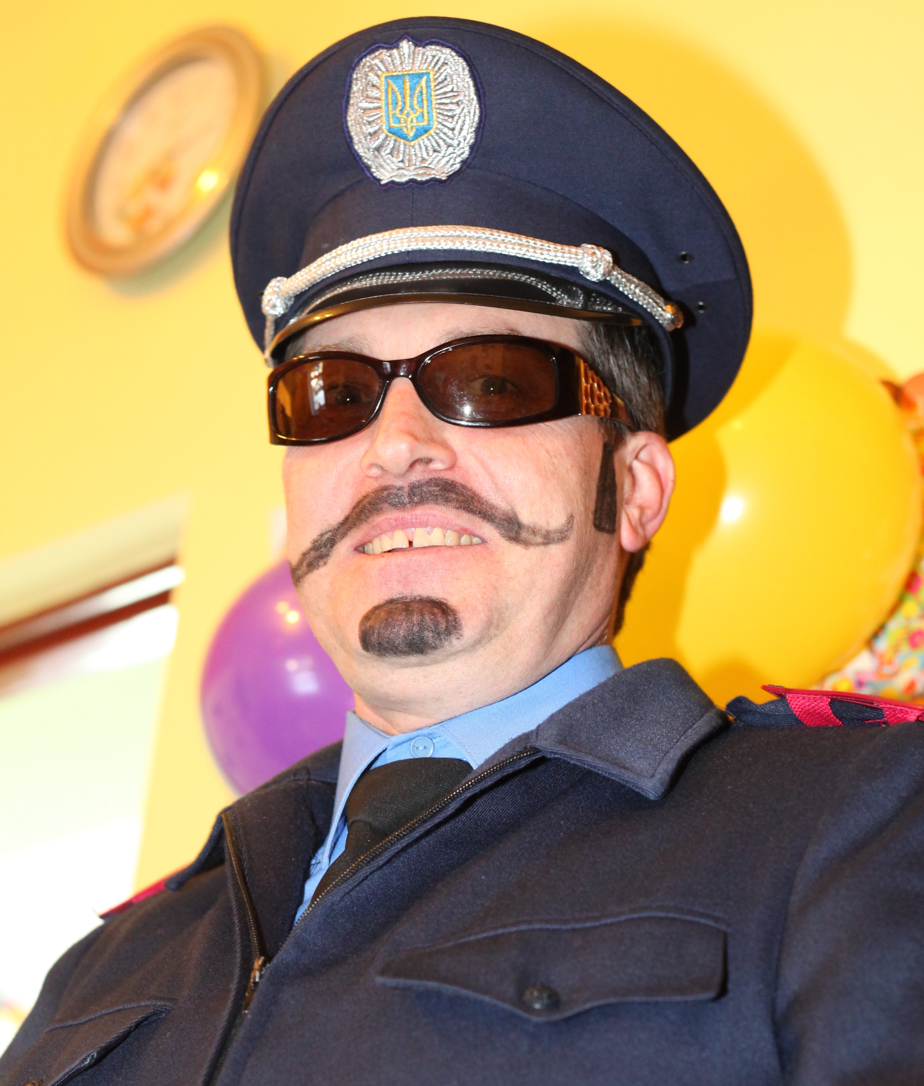 a handsome Catholic man dressed up as a policeman