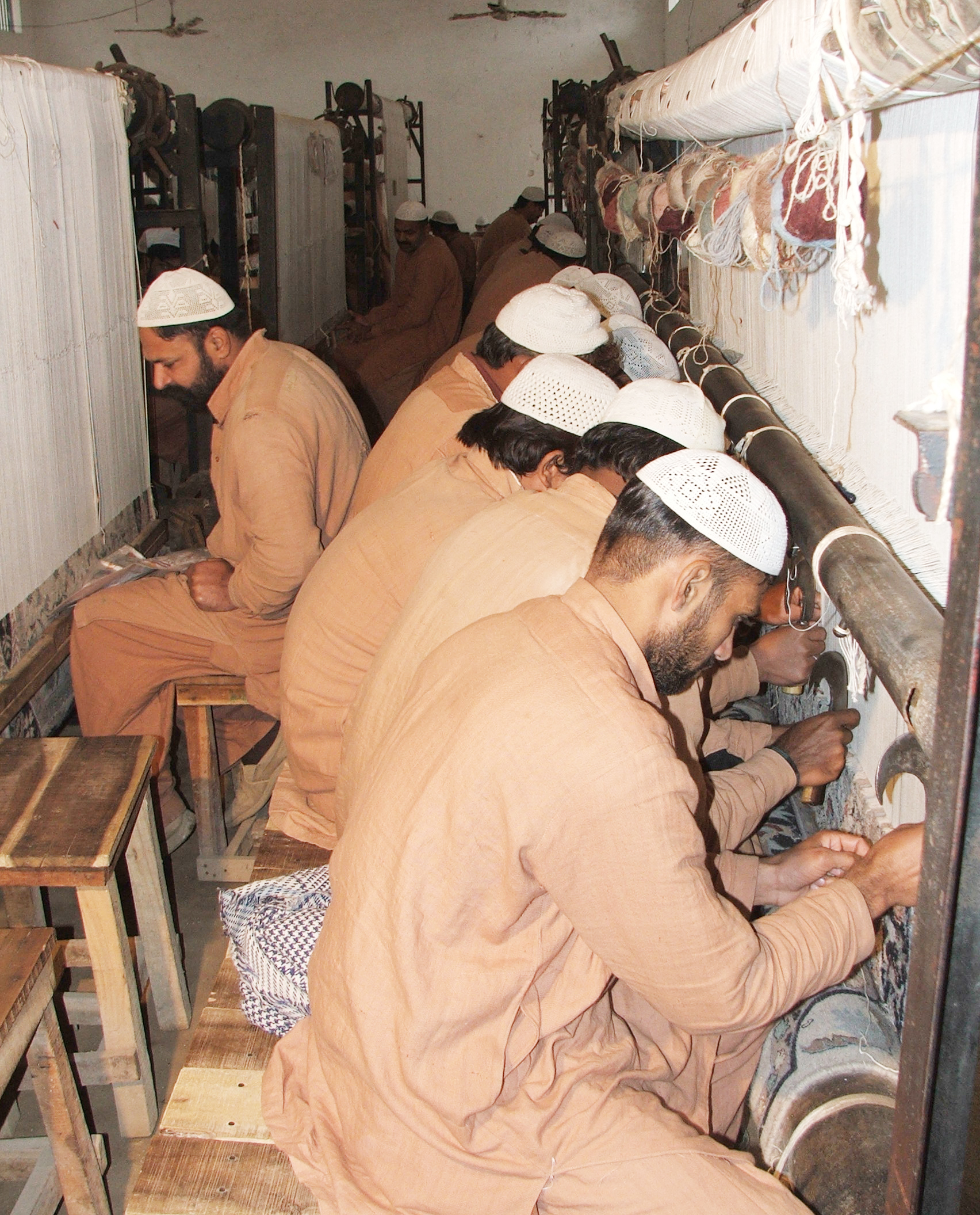 Correctional Activities in Central Jail Faisalabad, Pakistan in 2010 - Convicted prisoners busy in knitting Persian designs' carpets