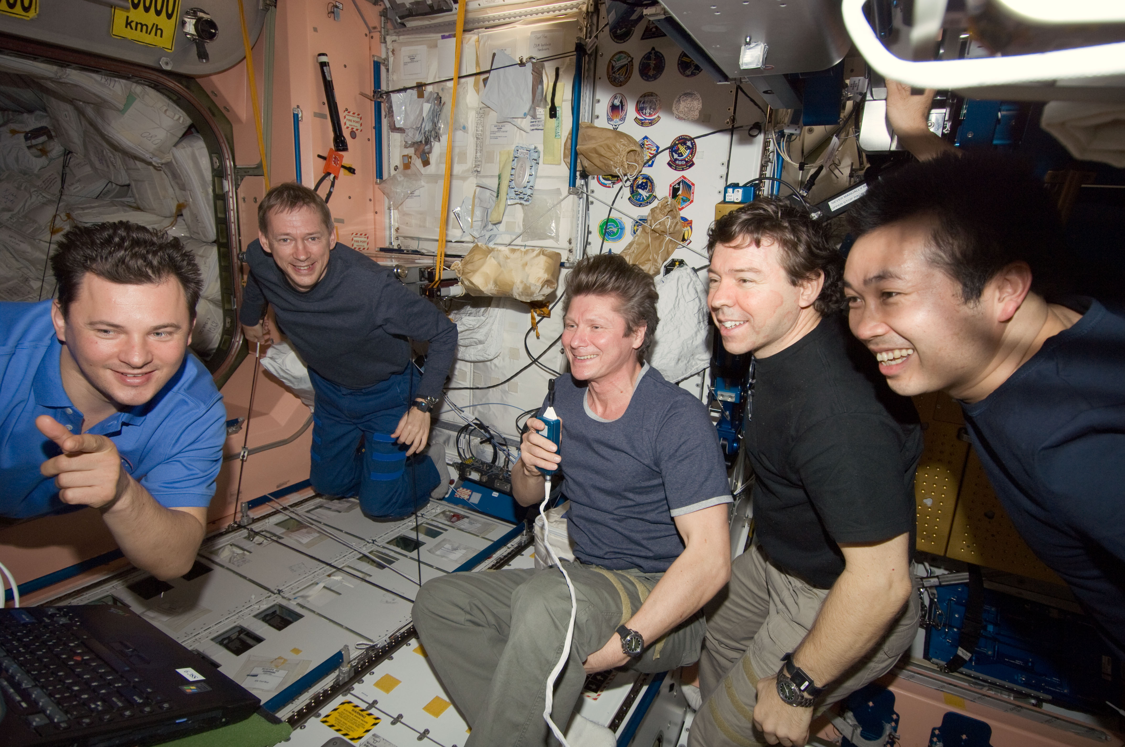 ISS-20 crew members view a monitor in the Unity node