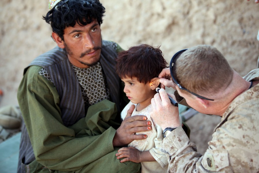 Defense.gov News Photo 101122-M-3860M-149 - Chief Petty Officer David Worrell the leading chief hospital corpsman for 3d Battalion 25th Marine Regiment treats an Afghan child during a