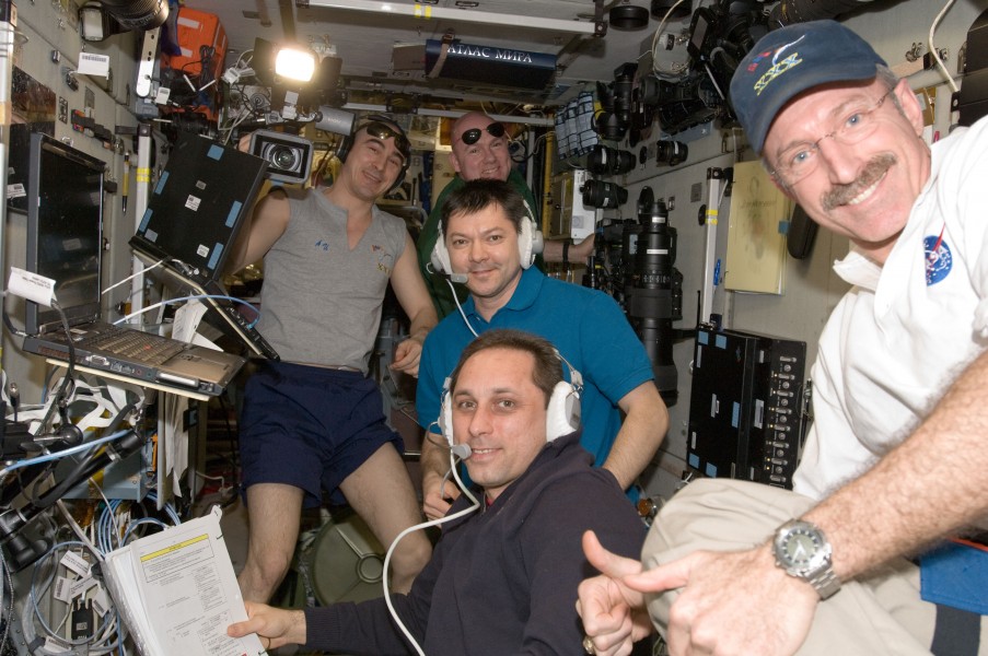 Expedition 30 crew in the Zvezda Module after successful docking of Progress M-14M