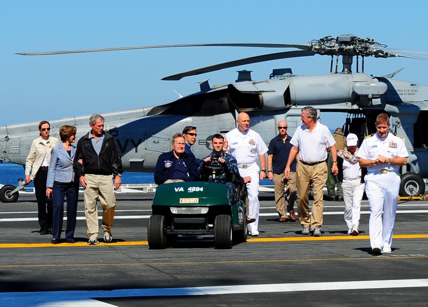 Flickr - Official U.S. Navy Imagery - The Bush family make their way across the flight deck of USS George H.W. Bush (CVN 77).