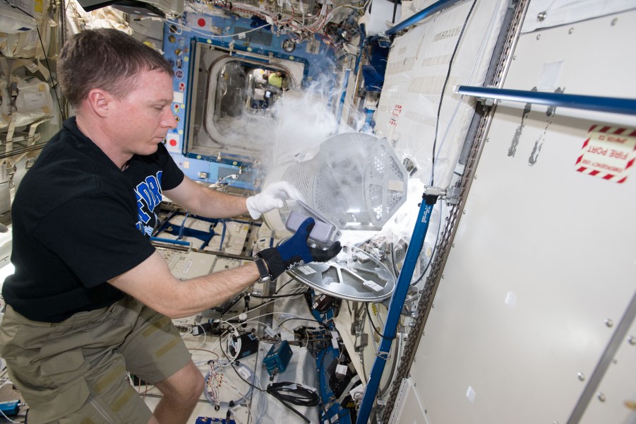 ISS-43 Terry Virts works with experiment samples