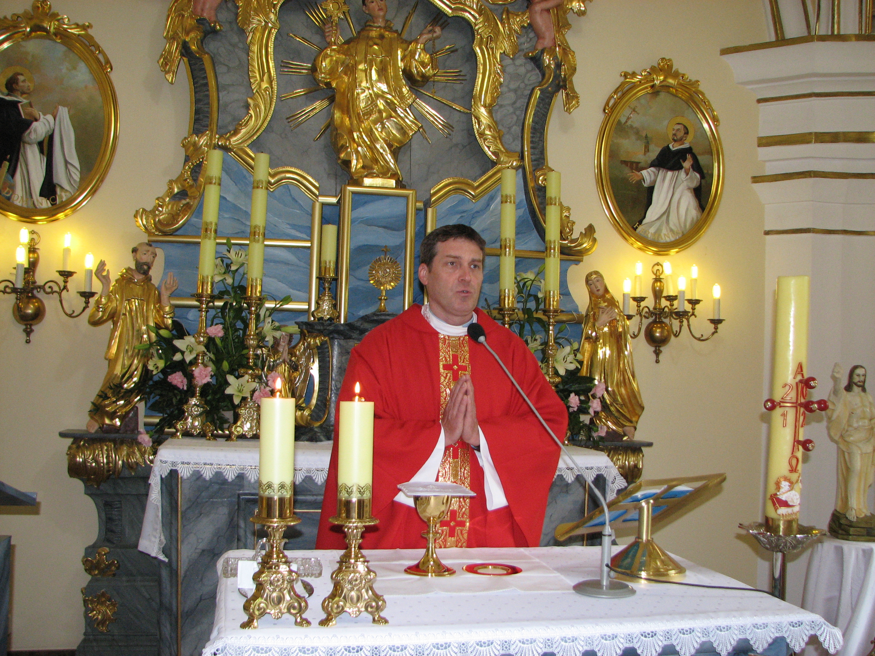 A catholic priest during a holy mass