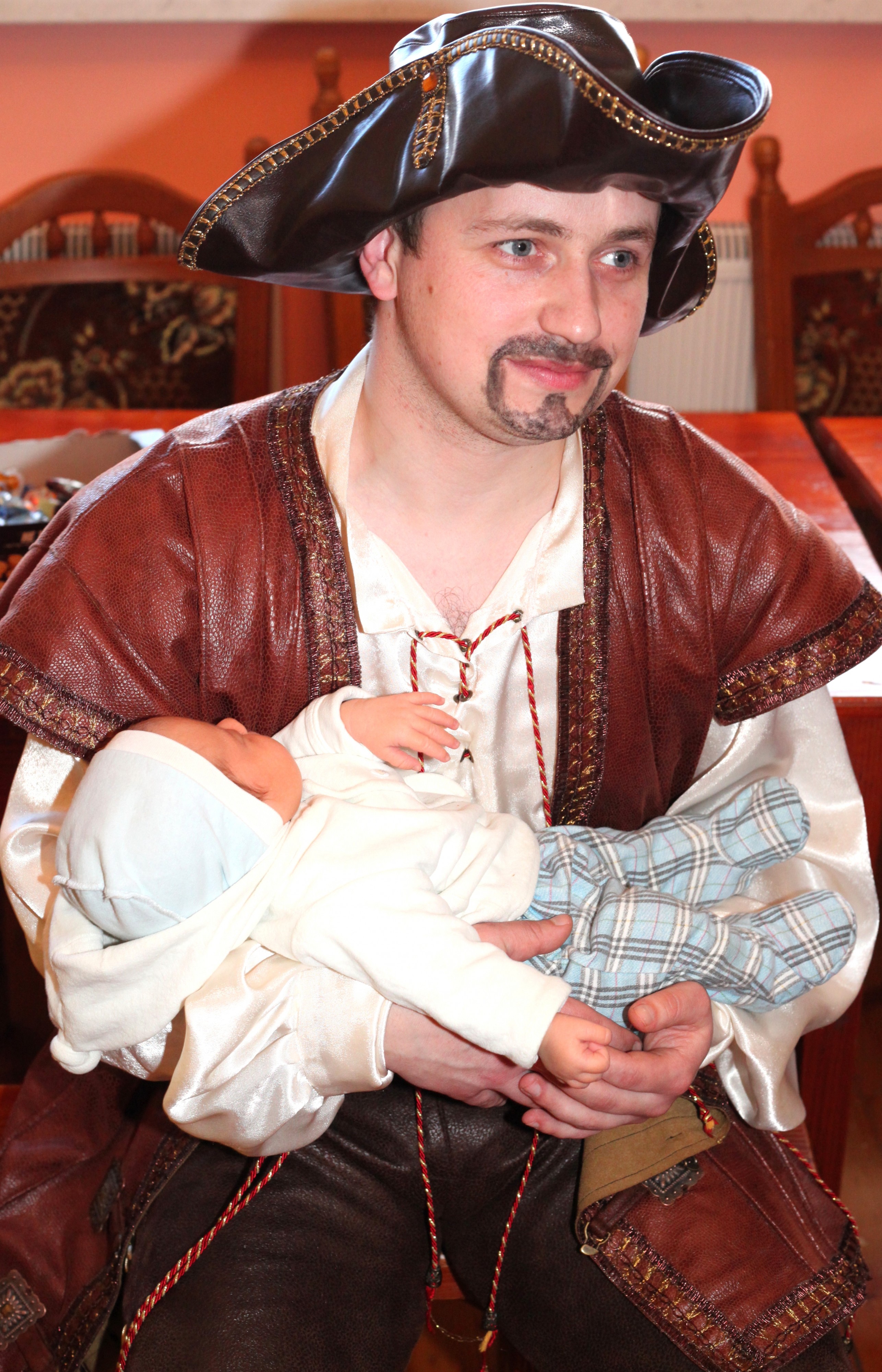 a handsome Catholic man with a baby