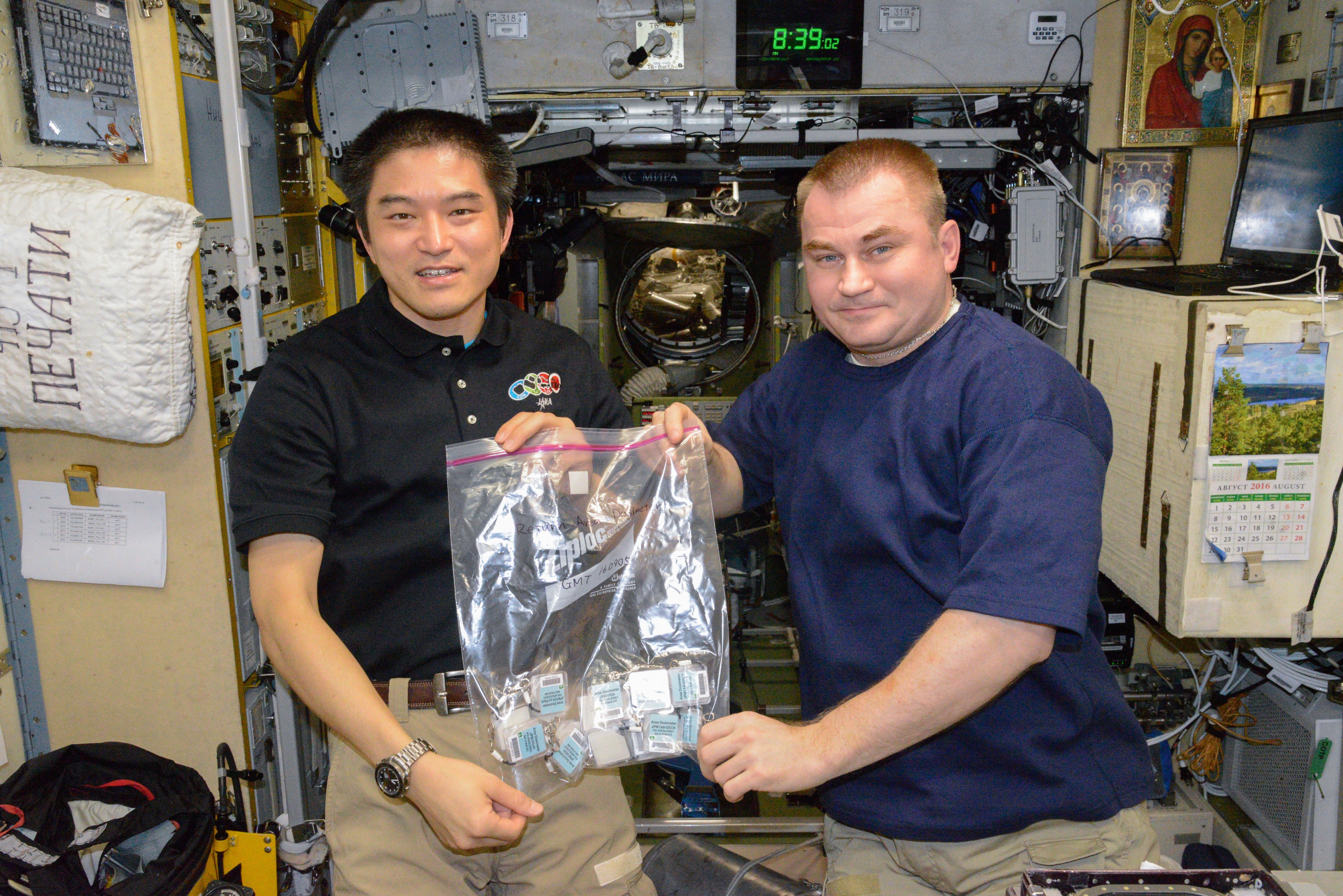 ISS-48 Takuya Onishi and Aleksey Ovchinin inside the Zvezda service module