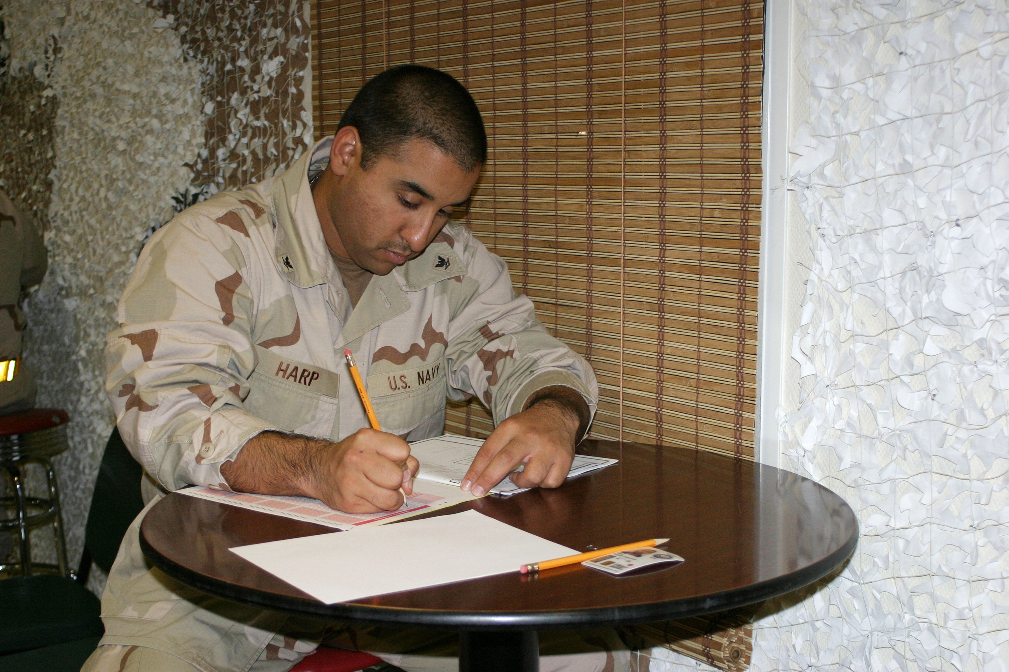 US Navy 060309-N-3207B-003 Culinary Specialist 3rd Class Ricardo Harp assigned to Patrol Squadron Four Seven (VP-47) participates in the E-5 Navy-wide Advancement Exam
