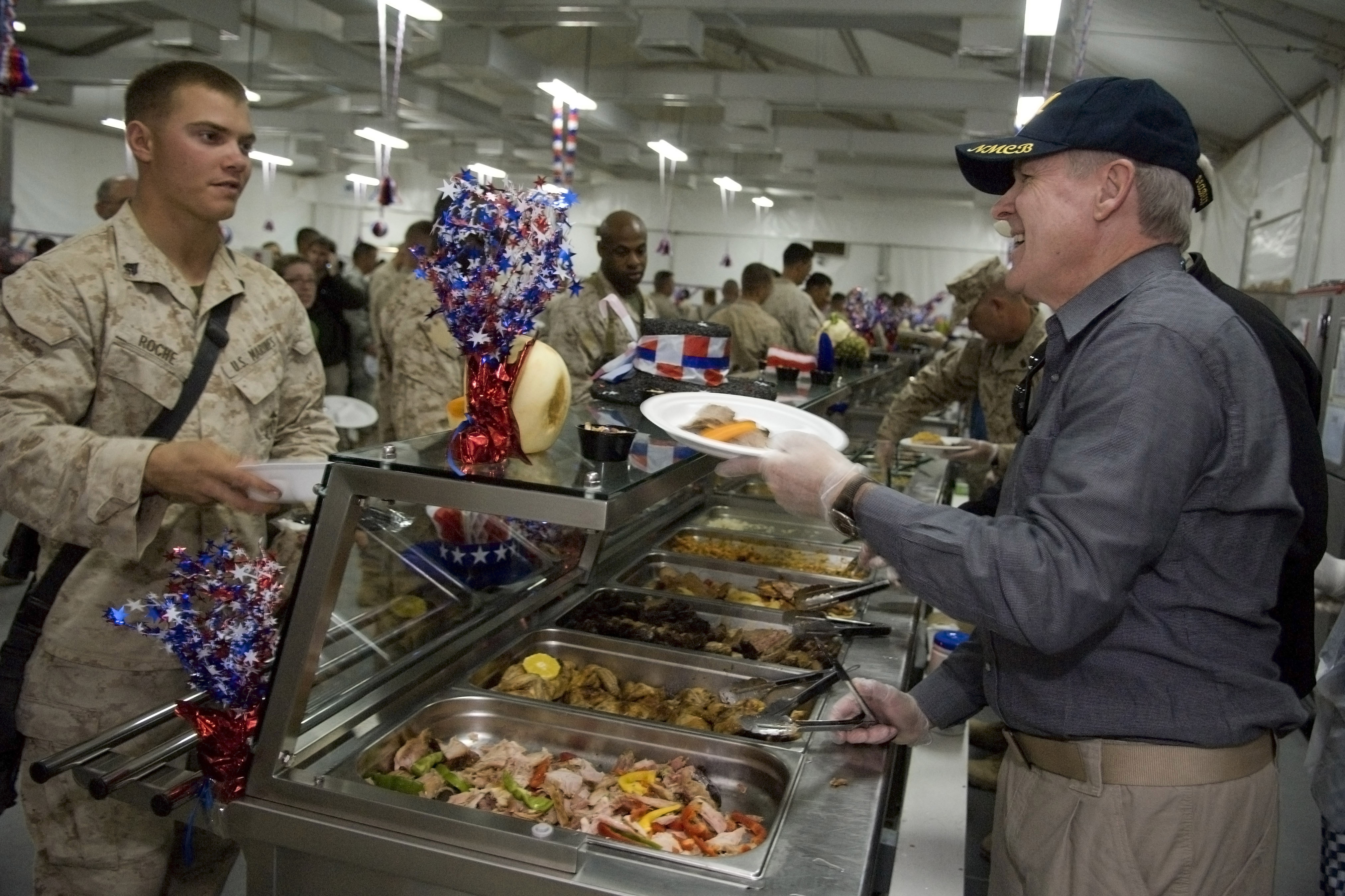US Navy 091126-N-5549O-194 Secretary of the Navy the Honorable Ray Mabus serves turkey to Marines and Sailors Thanksgiving Day at Camp Leatherneck