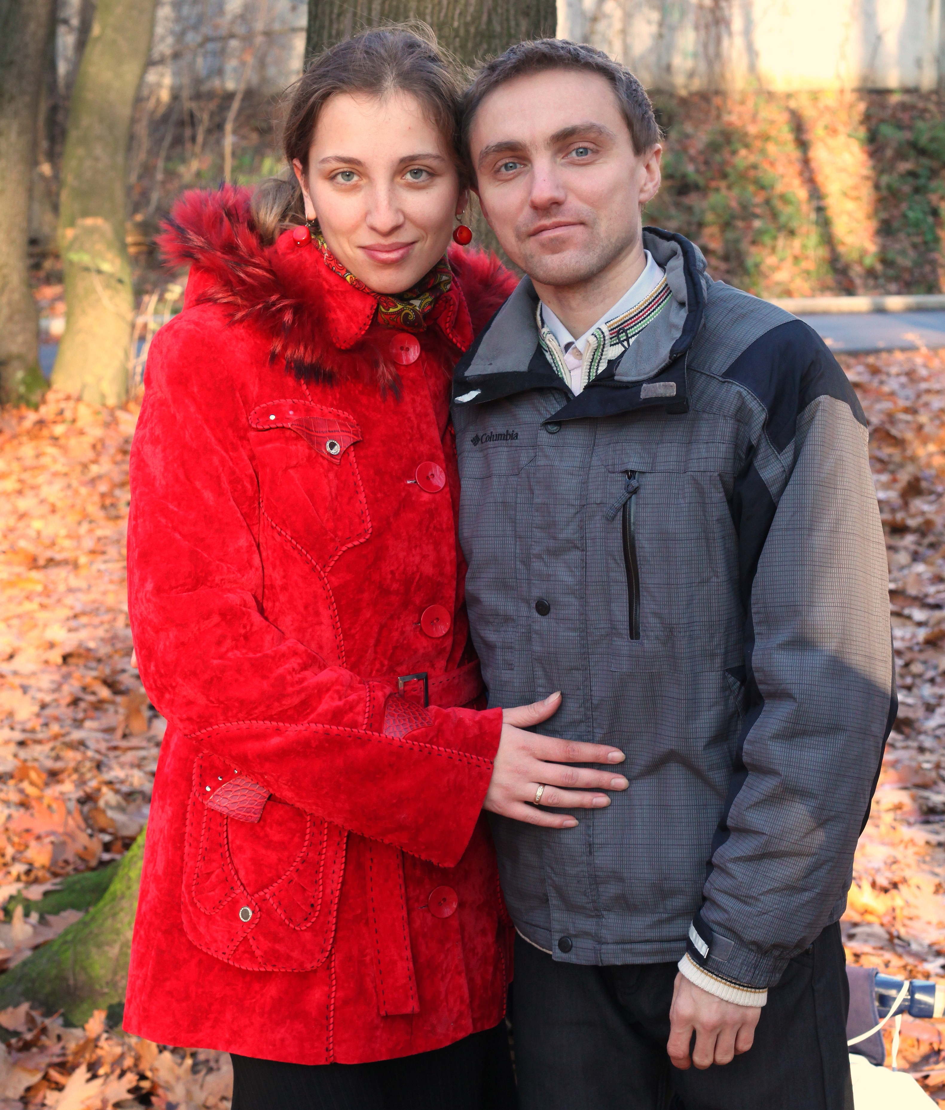 a beautiful Catholic wife with her husband in a park, photo 2