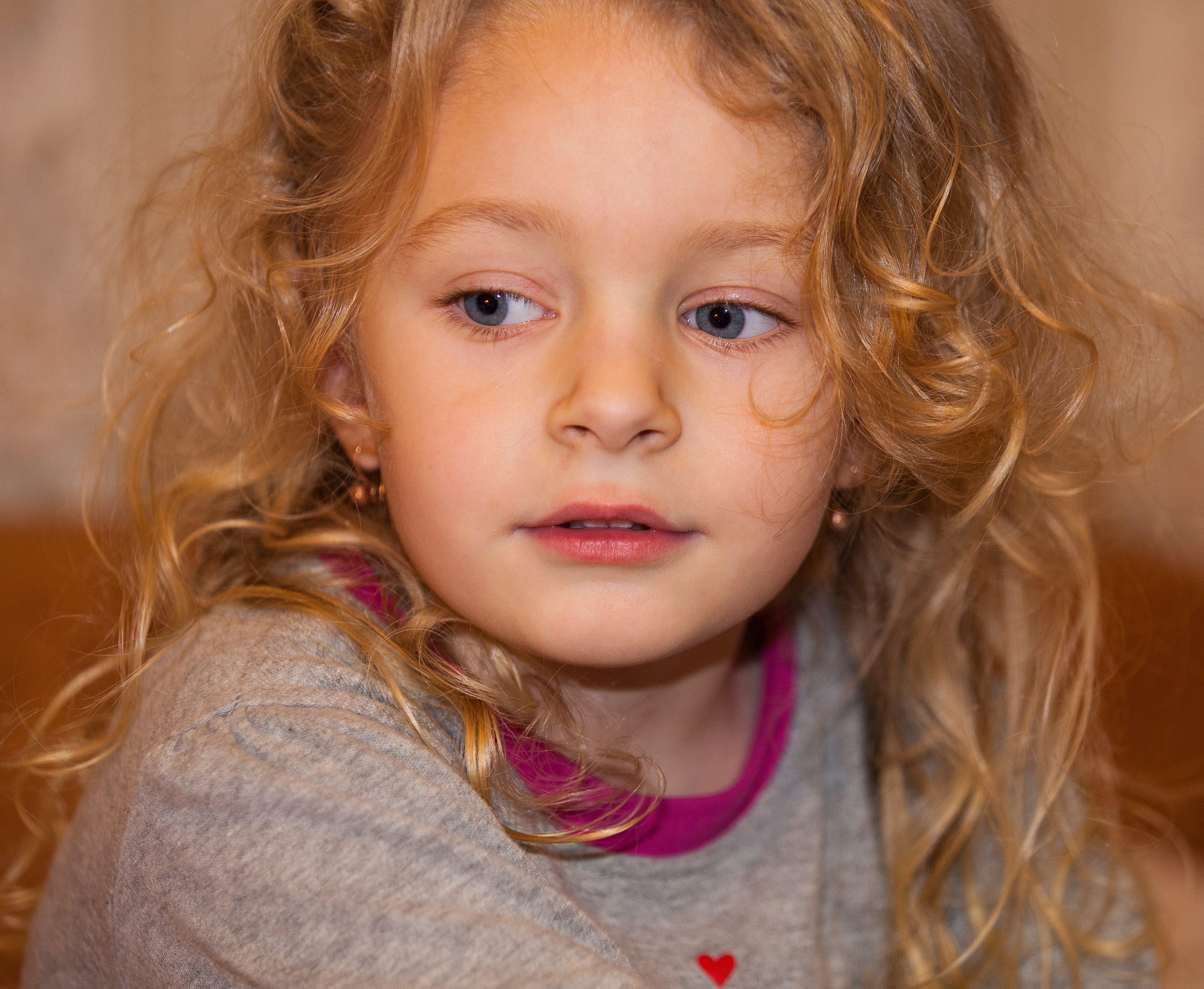 a cute blond child girl photographed in January 2014, photo 4 out of 4