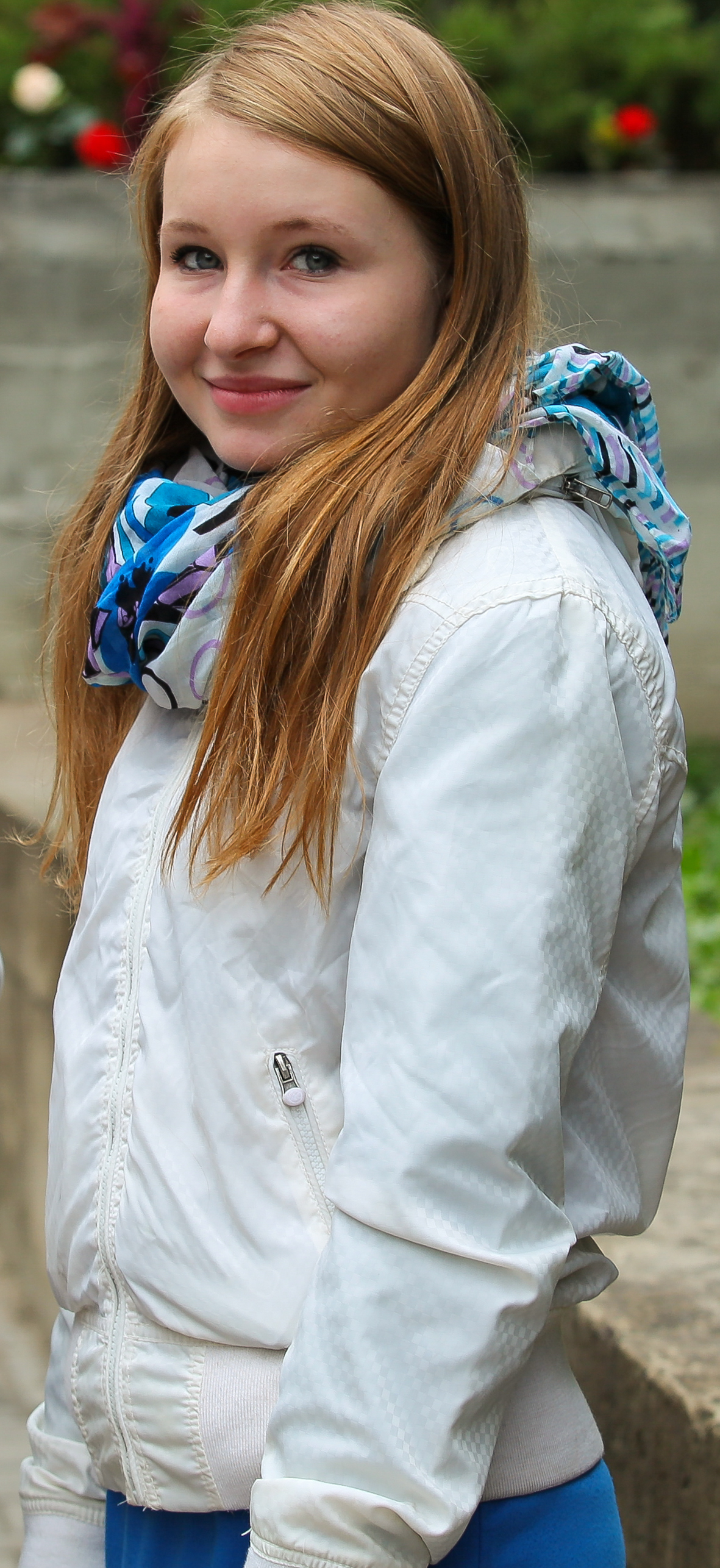 a cute blond girl near a Catholic church photographed in September 2013, picture 2/6