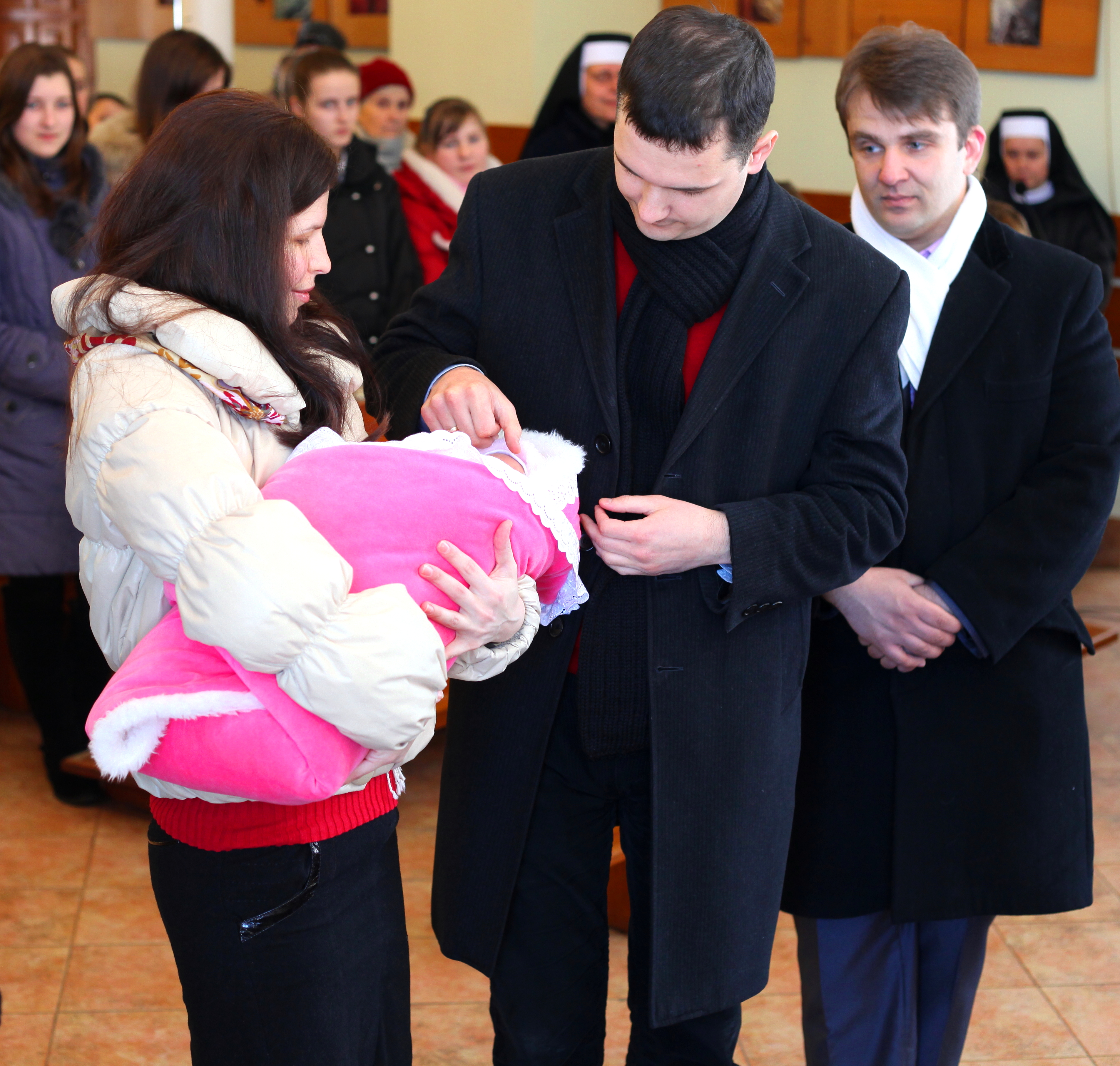 baptism of a baby girl in a Catholic church, picture 1