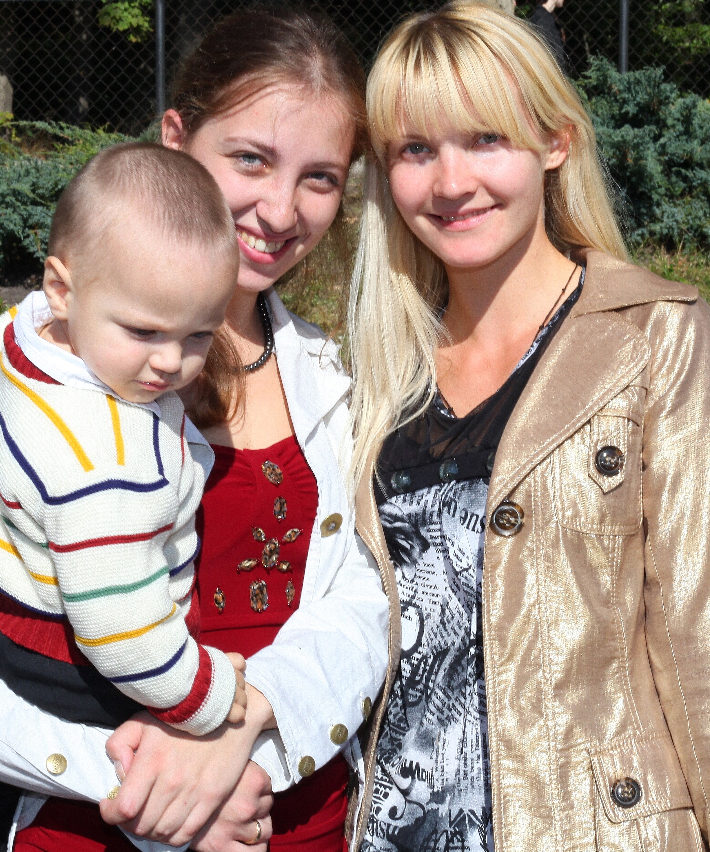 two beautiful young charming Catholic women and a baby boy, photo 2