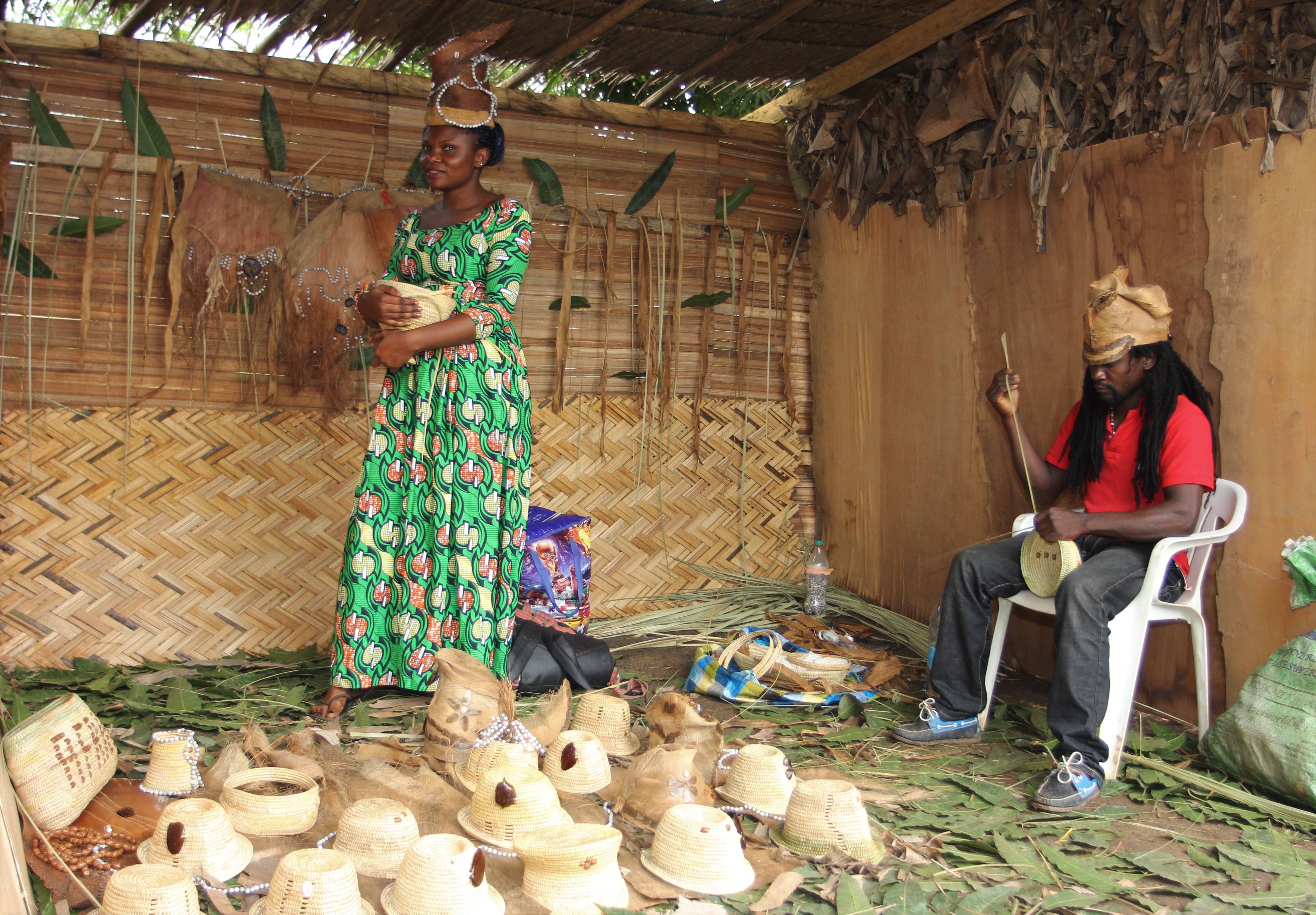 Hat Vendor in Bafia with the Hat Maker in Bafia - Cameroon