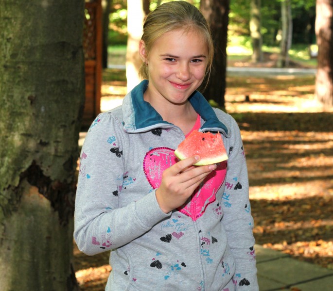 a beautiful appealing smiling Catholic girl eating water-melon, photo 25