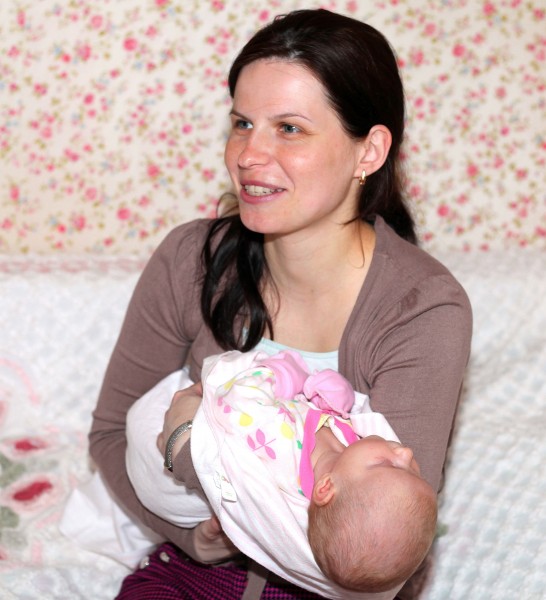 a beautiful brunette Catholic woman with her baby daughter, picture 3