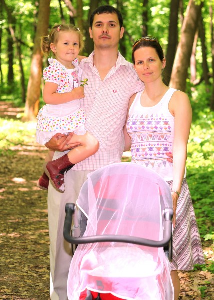 a beautiful Catholic family in a forest in May 2013