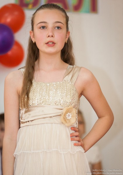 a beautiful schoolgirl wearing a dress photographed in June 2015, picture 8