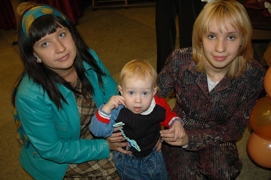 A baby boy with mom and aunt