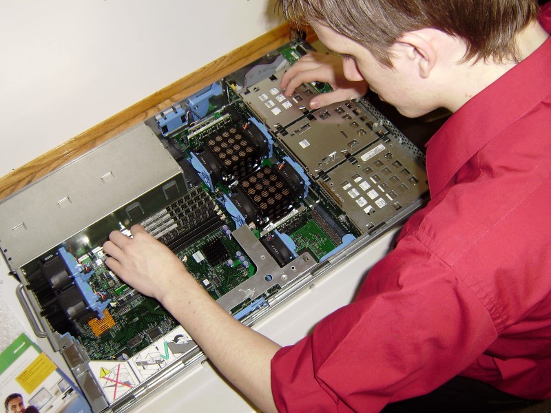A Centriq Training Student works with hardware