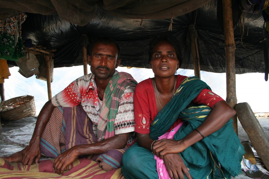A couple in their polythene shelter (3683015519)