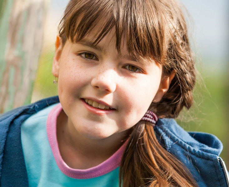 a cute brunette Catholic child girl photographed in May 2014, picture 2/5