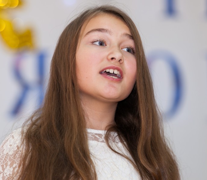 a cute young girl performing in school in December 2013, picture 11/14