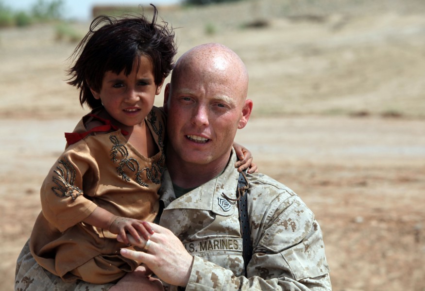 A Marine embraces an Afghan child (5000806253)