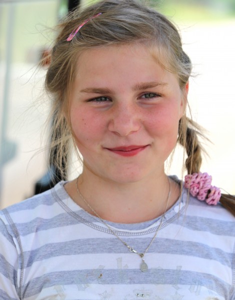 a young blond Catholic girl in a Catholic camp in July 2013, girl 4/4