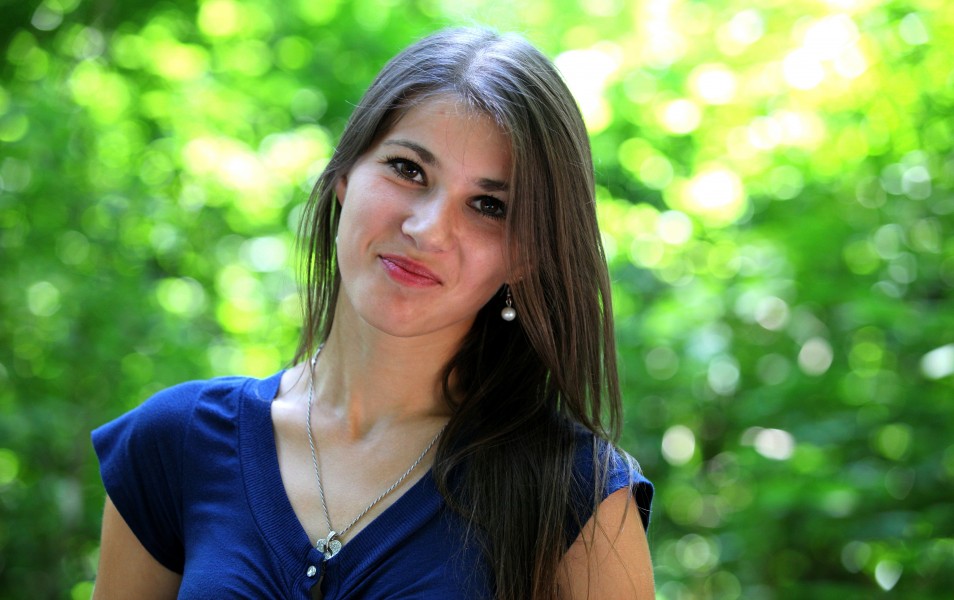 an attractive smiling girl (a Catholic Christian) photographed in July 2013, portrait 2/15
