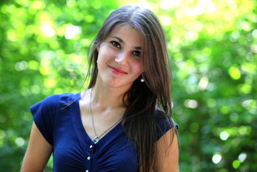 a smiling beautiful brunette girl (a Catholic Christian) photographed in July 2013, portrait 5/15