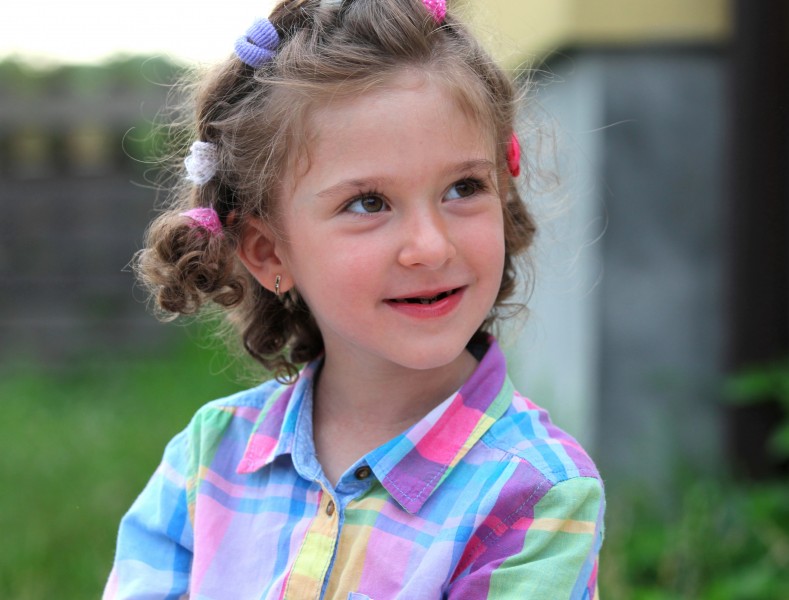 a smiling cute sweet brunette child girl in a Catholic camp Vacations with God, photographed in July 2013, portrait 6/14