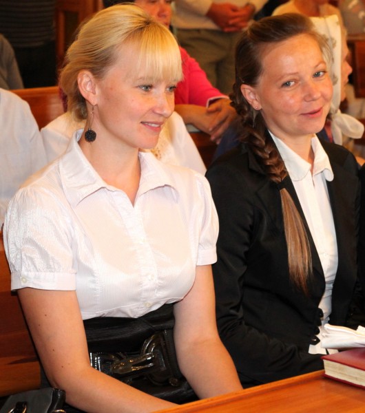 godmother (left) and mother at the baptism of a baby boy in the Catholic Church, picture 14