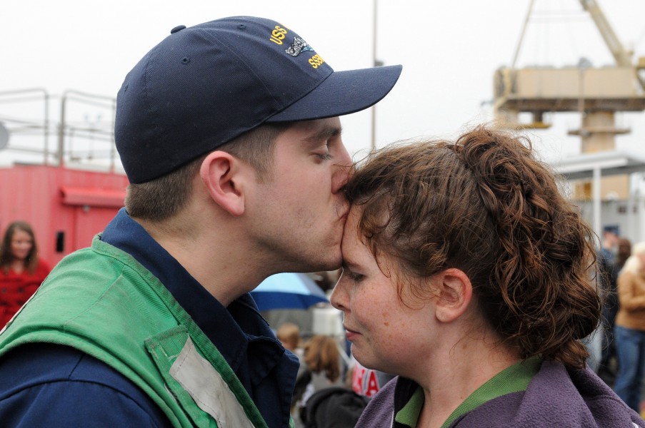 Flickr - Official U.S. Navy Imagery - Sailor kisses his wife after returning home.